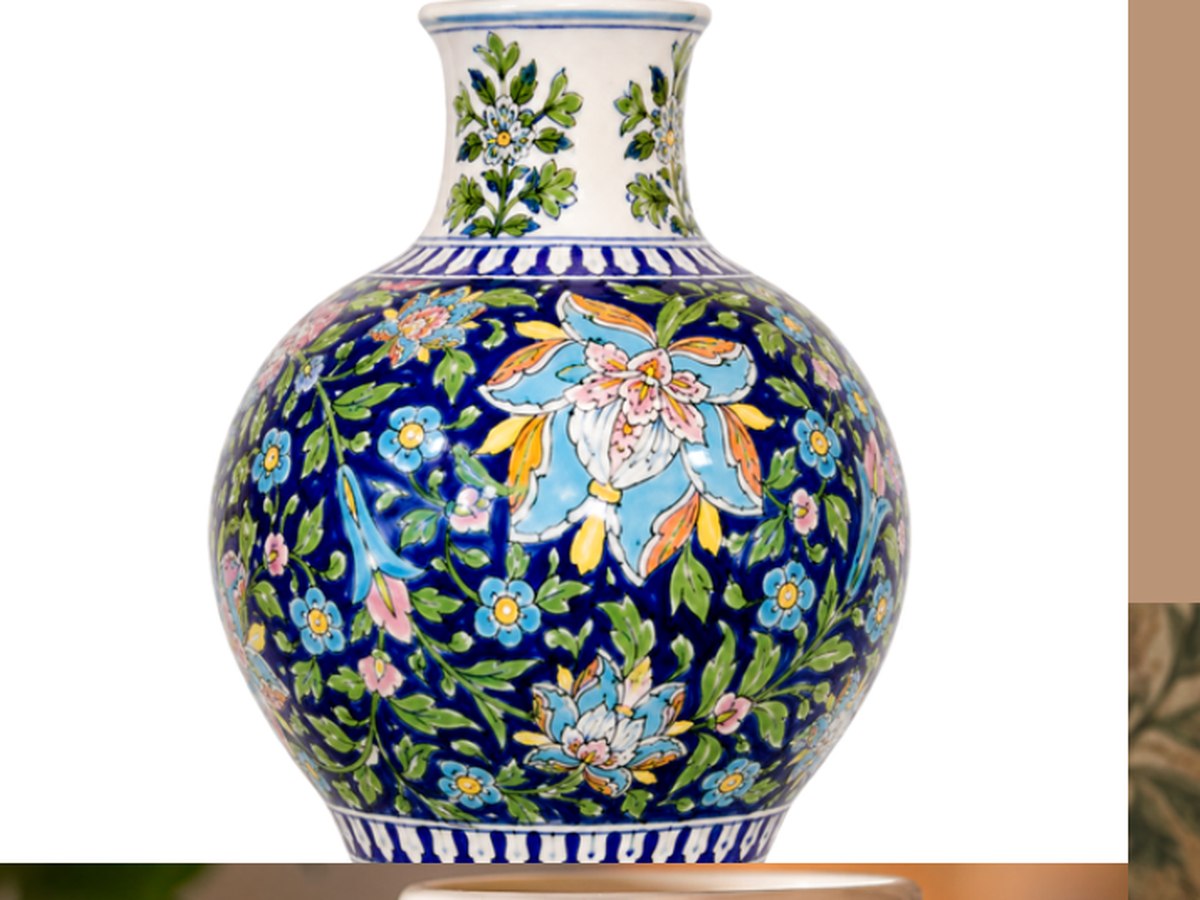 Close-up of floral hand painting on a vase